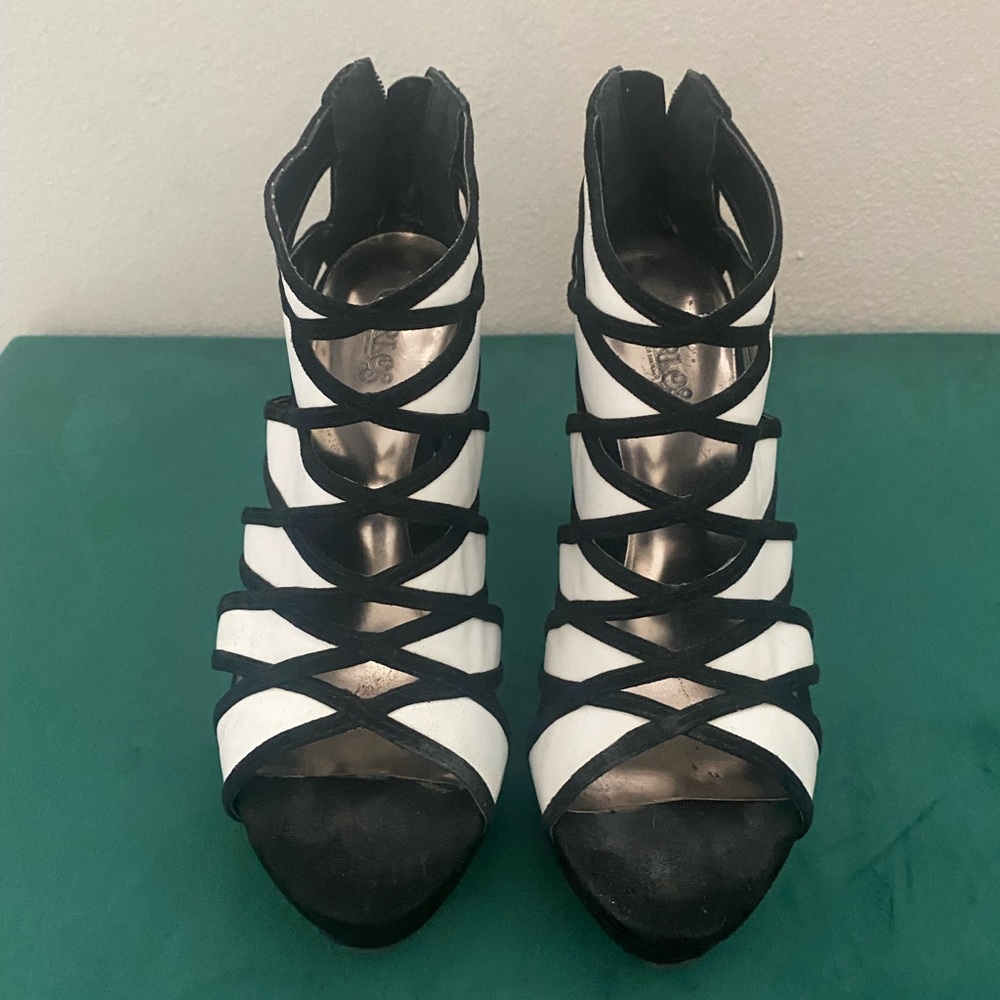 Carlos Santana black and white zip up heels